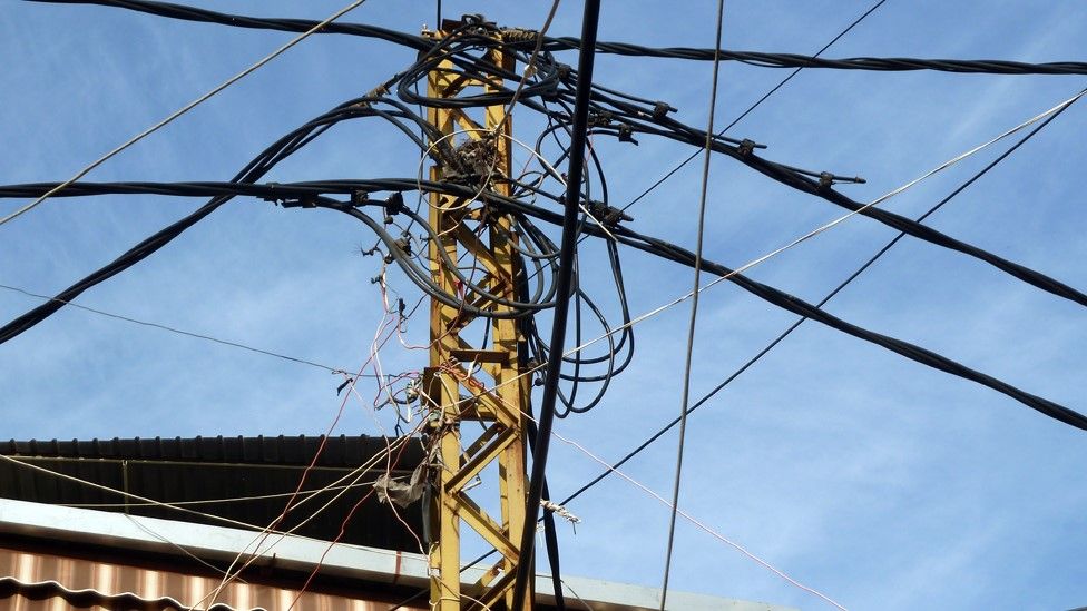 Electricity wires strung between buildings in Lebanon