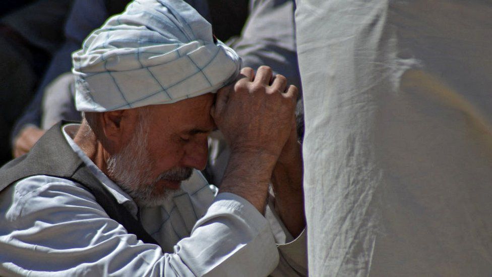 Man at Shia mosque, following the October 2021 attack in Kandahar