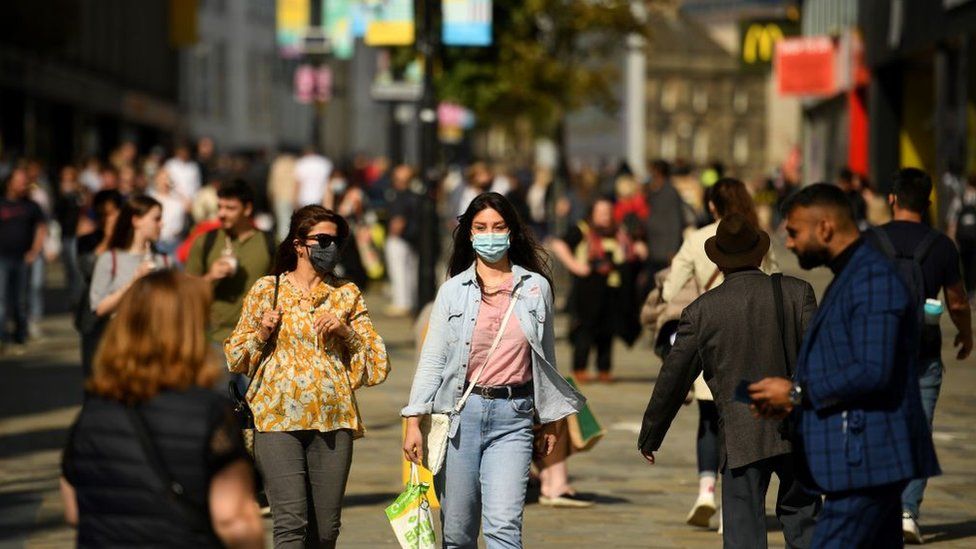 Library image of shoppers in Newcastle city centre wearing face masks