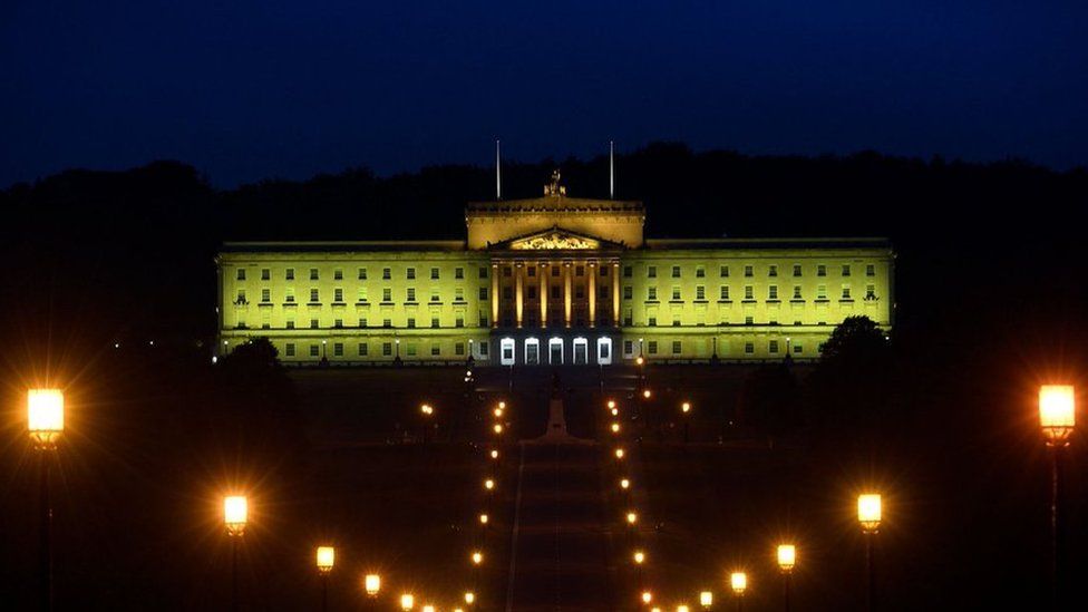 Stormont bathed in yellow light