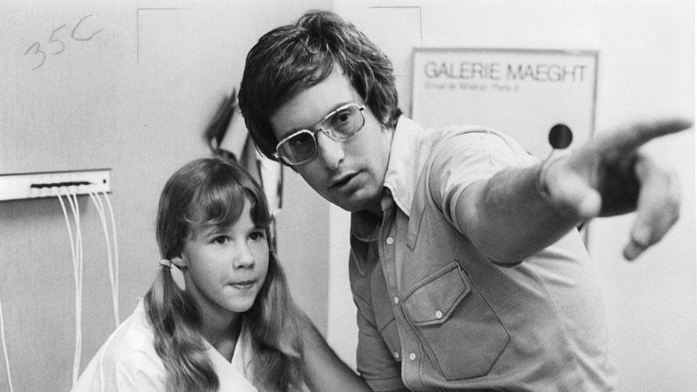 William Friedkin on set alongside lead actress from The Exorcist, Linda Blair