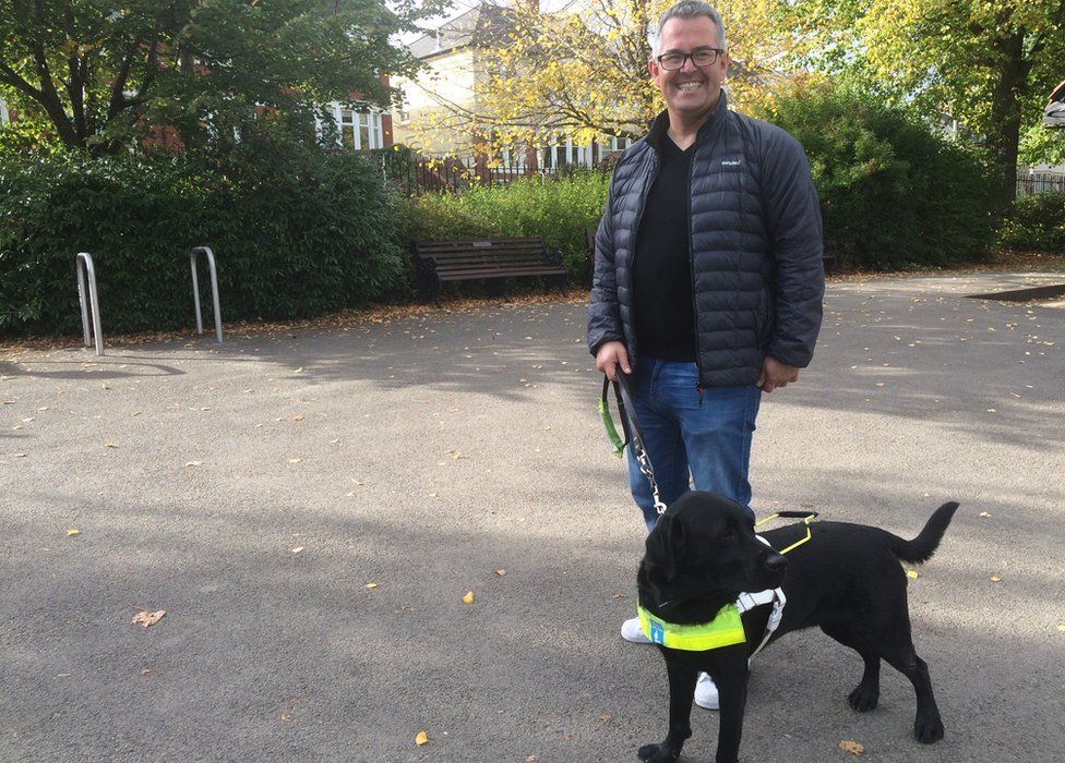 Gareth Davies with his guide dog