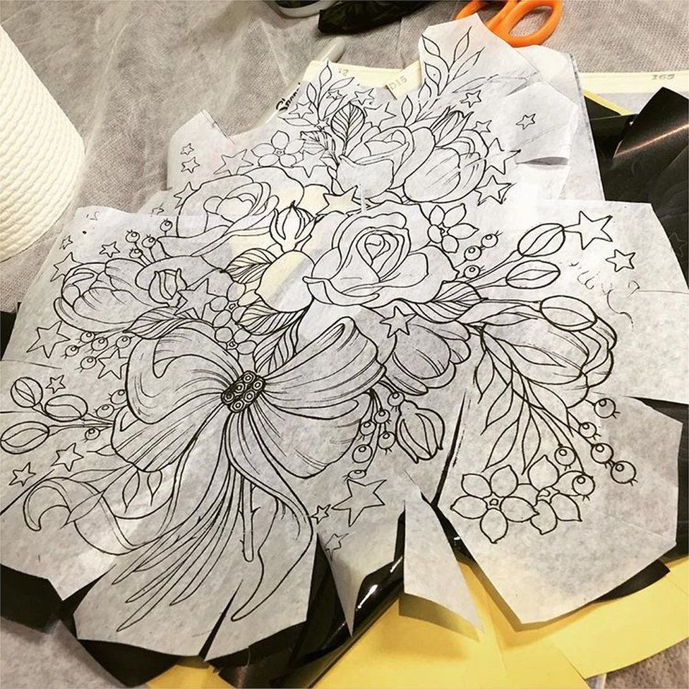 Paper shows design for Alison Habbal's tattoo