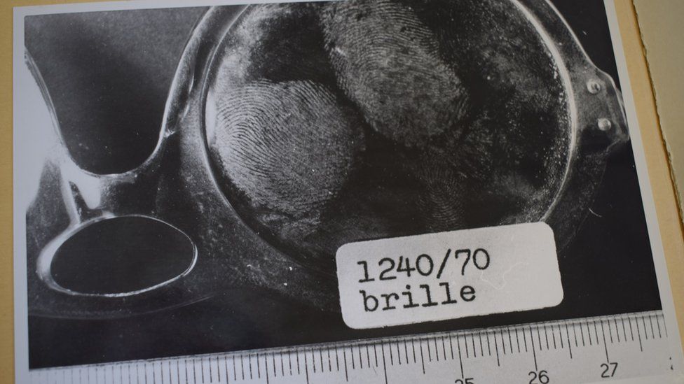 Police photo of the sunglasses with fingerprints on the lens