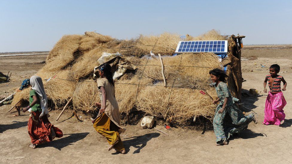 Indian villagers at a solar farm