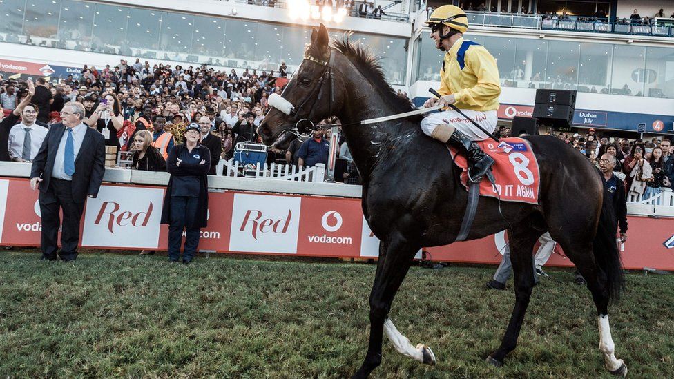 Jockey Anton Marcus rides Do it Again after winning the Vodacom Durban July horse race in Durban, on July 7, 2018