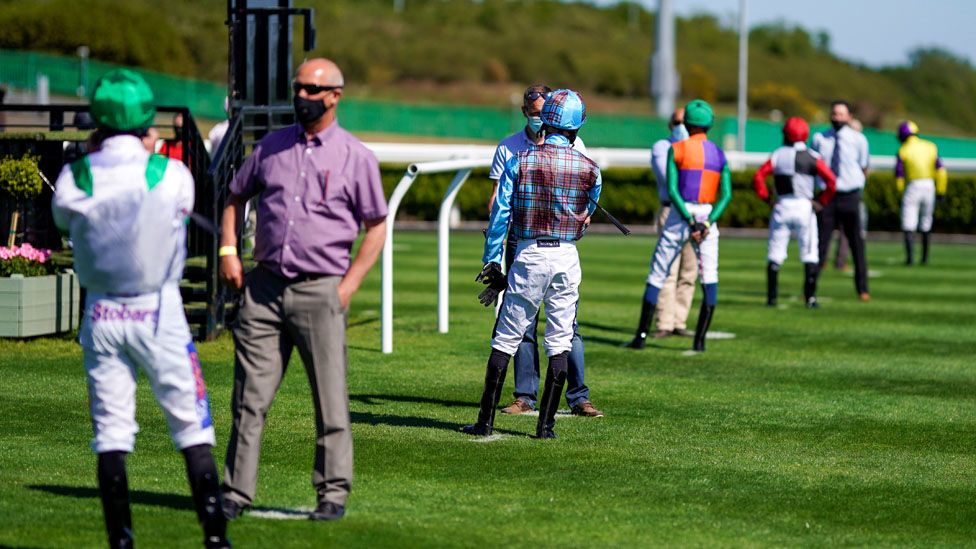 Social distancing in the parade ring at Newcastle Racecourse, as racing resumes behind closed doors following the outbreak of the coronavirus disease (COVID-19), Newcastle Upon Tyne,