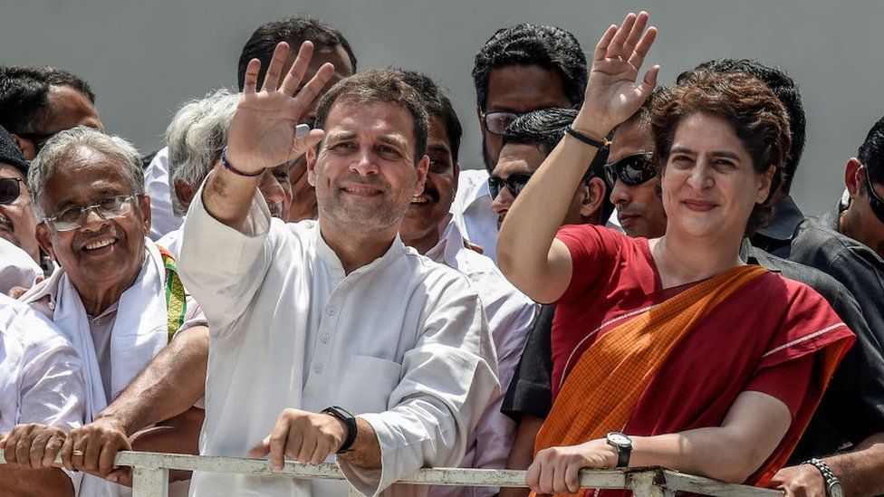 Rahul Gandhi and Priyanka Gandhi wave at the crowd in the road show after Rahul Gandhi filing nominations from Wayanad district on April 4, 2019