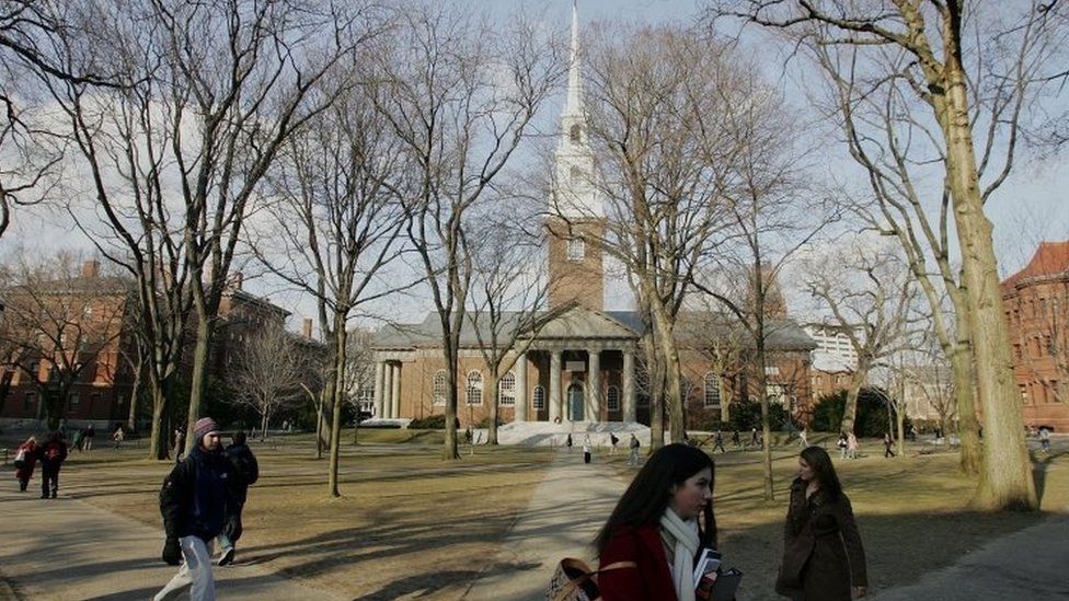 Harvard students walk through the university campus. File photo