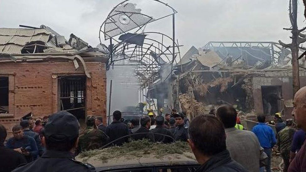 Crowds look at destroyed buildings in Ganja. Photo: 4 October 2020