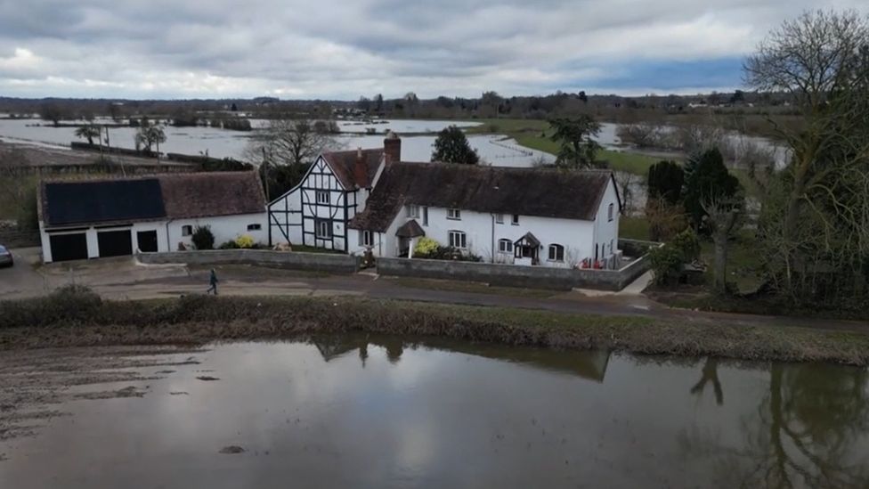 House next to floods