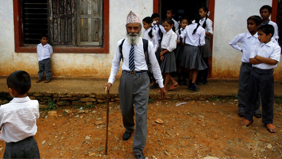Nepali grandfather Durga Kami, 68, at the school he attends