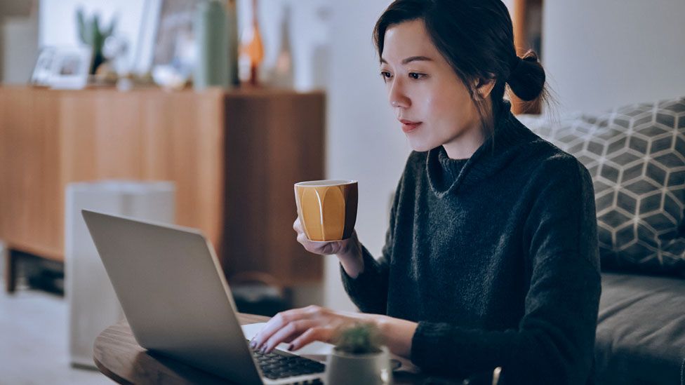 Stock image of a woman on a laptop