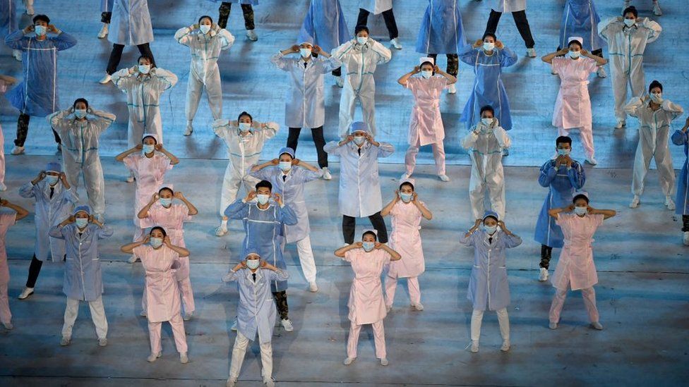 Performers dressed as nurses take part in a Cultural Performance as part of the celebration of the 100th Anniversary of the Founding of the Communist Party of China, at the Bird's nest national stadium in Beijing on June 28, 2021.