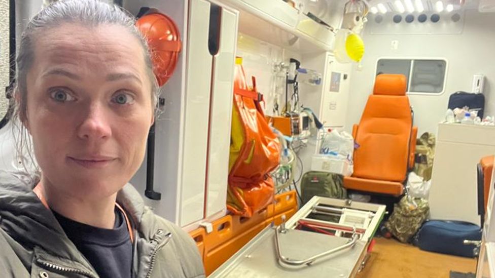 Dr Irnya Rybinkina looks at the camera from an ambulance