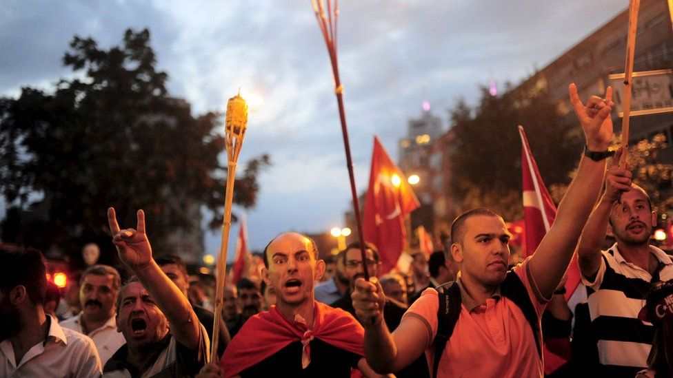 Nationalist groups shout slogans during a protest in Istanbul, Turkey, 8 September 2015