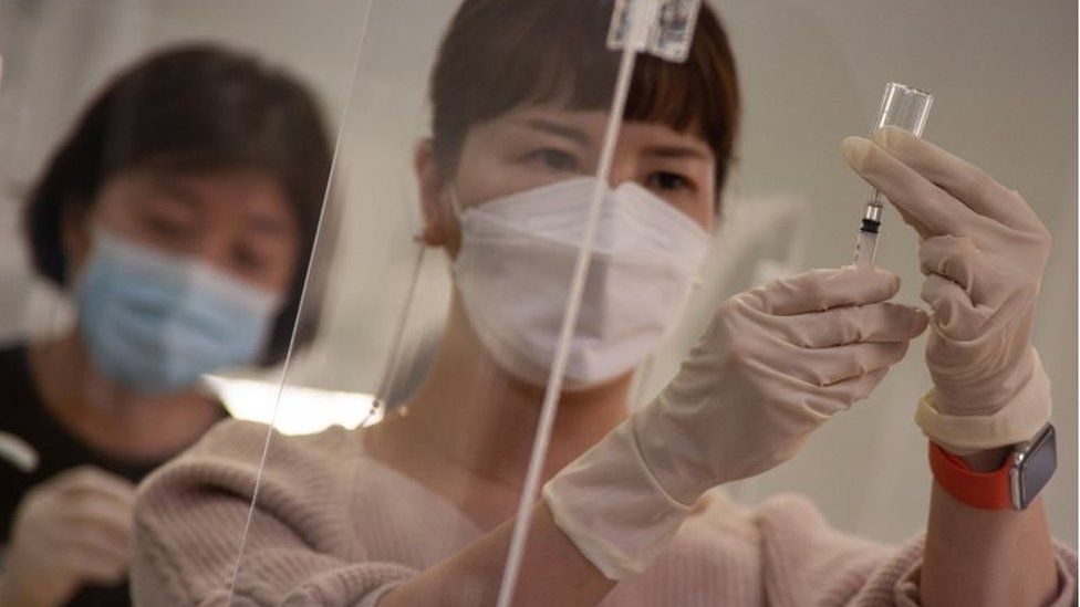 Medical workers practice during a training to give COVID-19 vaccine shots at a training facility of the Korean Nurses Association in Seoul, South Korea, 17 February 2021.
