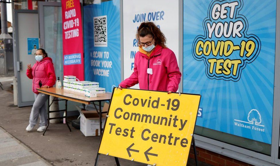Officials outside of a Covid testing centre in London in December 2021