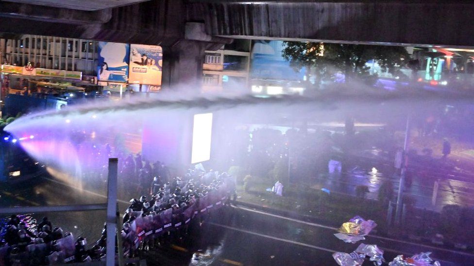 Police use water cannons to disperse pro-democracy protesters during an anti-government rally in Bangkok on October 16, 2020