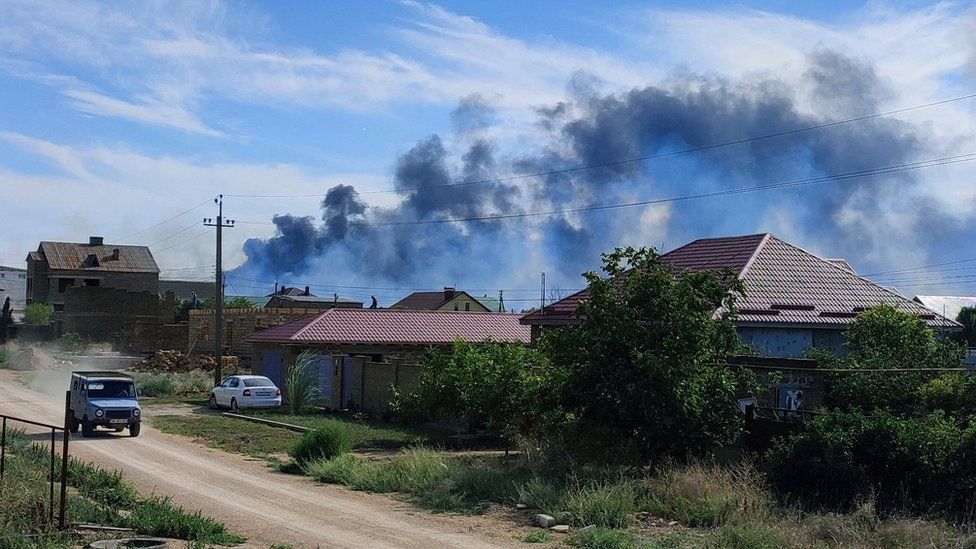 Smoke rises after explosions were heard from the direction of a Russian military airbase near Novofedorivka, Crimea August 9, 2022. REUTERS/Stringer