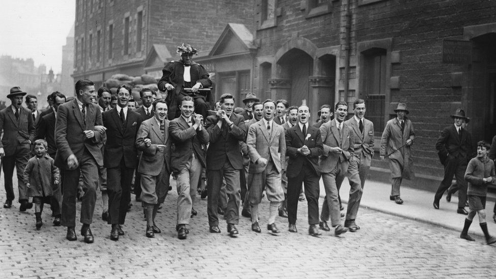 Scottish athlete and missionary, Eric Henry Liddell (1902 -1945) being carried round the streets after his Olympic victory
