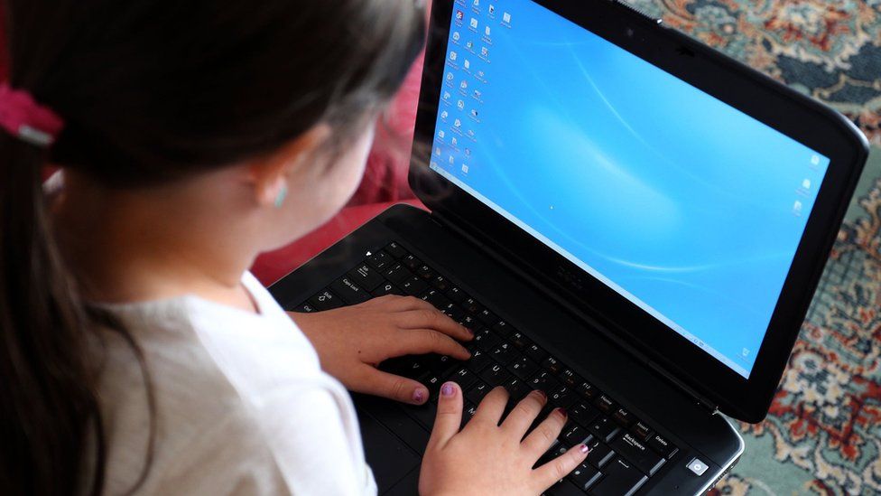 Child using a laptop computer