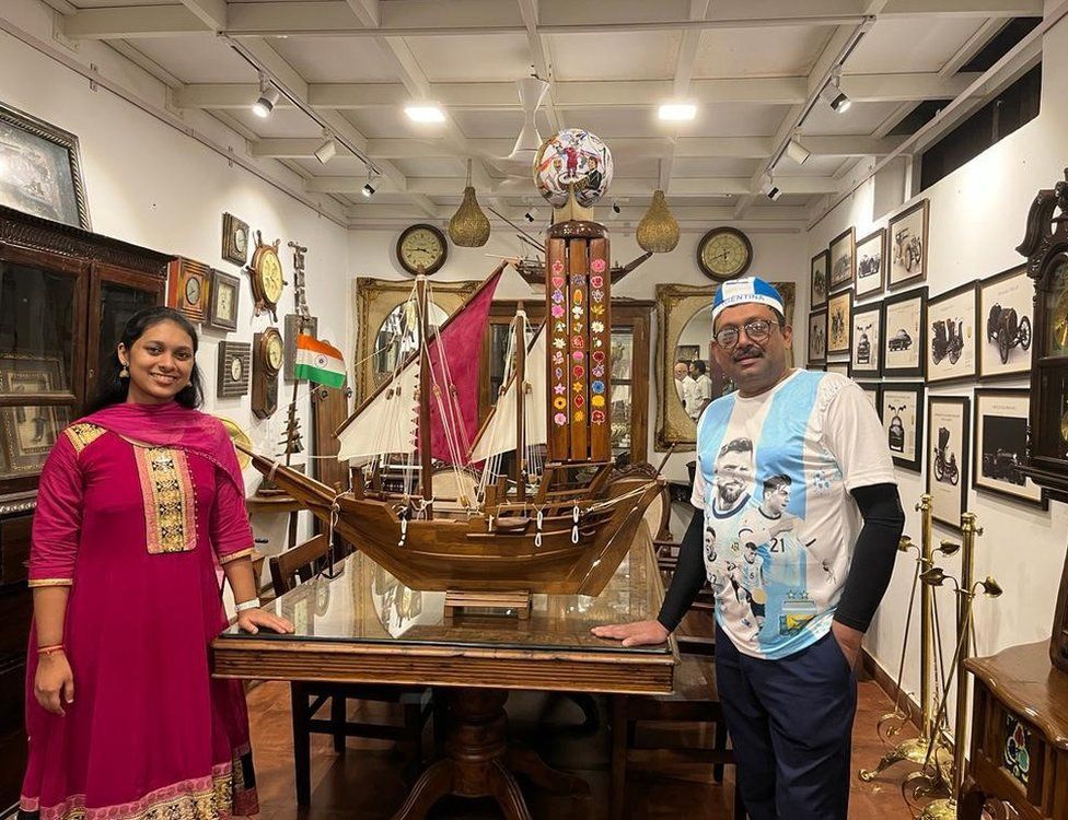 Hashir Ali and artist Meghna Unnikrishnan with miniature dhow he’s carrying with him to Doha