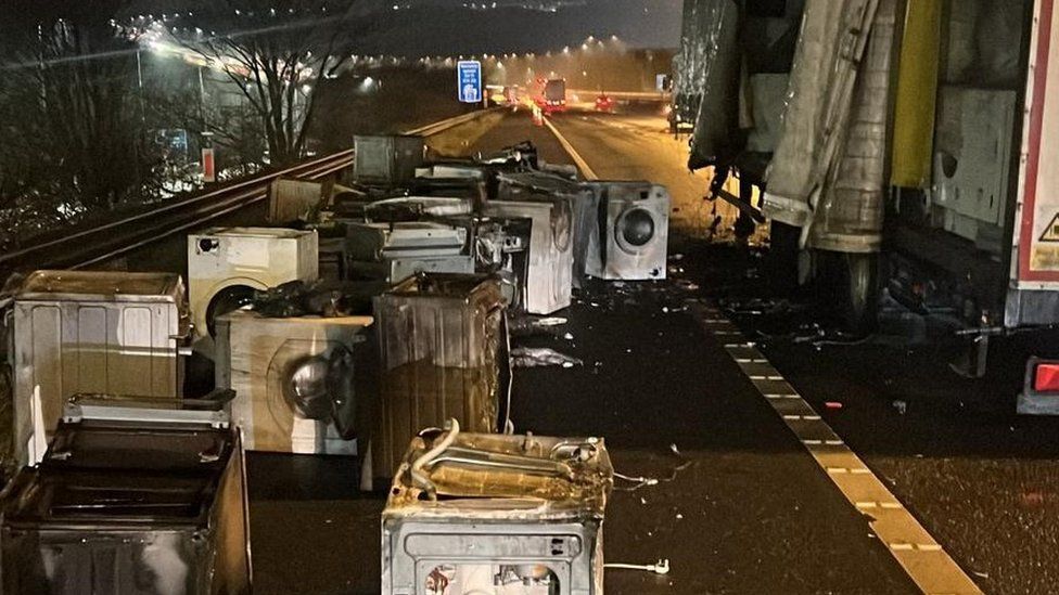 Scene of fire showing burned out household appliances