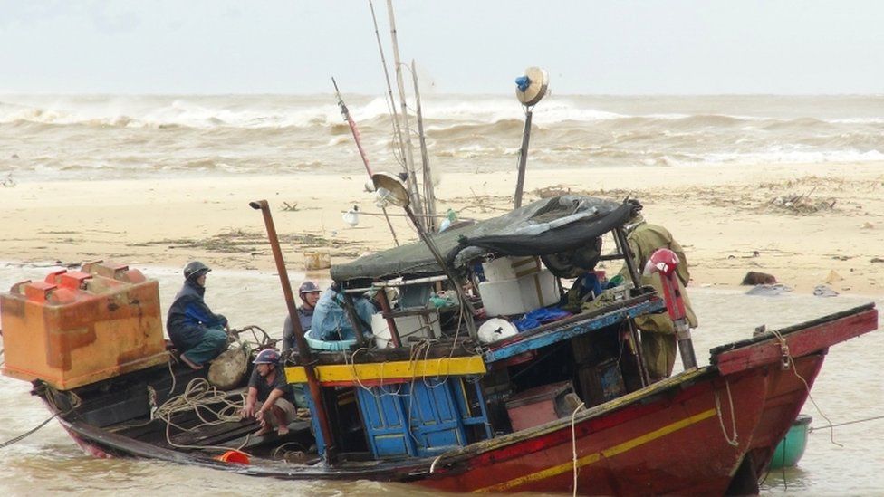Storm Vamco damaged buildings and fishing boats like this one in Quang Binh province