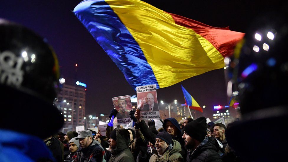 Romanians demonstrate against controversial decrees to pardon corrupt politicians and decriminalise other offenses in front of the government headquarters in Bucharest, on February 1, 2017