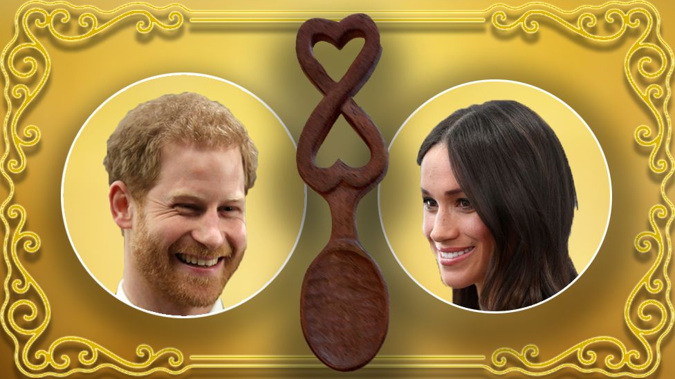 Harry and Meghan either side of a Welsh love spoon
