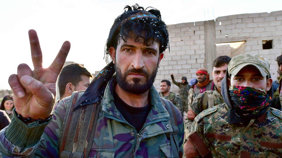 Syrian Democratic Forces fighters celebrate after returning from the front lines around Baghuz, Syria (19 March 2019)