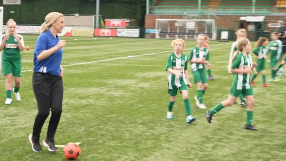 Laura Bassett playing with the young people at Bedworth United