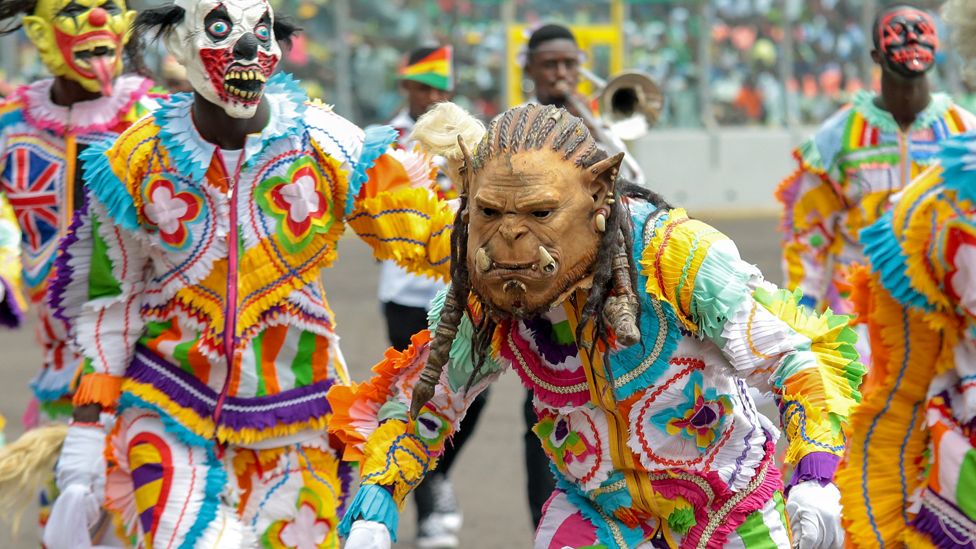 Traditional dancers in masks during independence celebrations in Kumasi, Ghana - Friday 6 March 2020