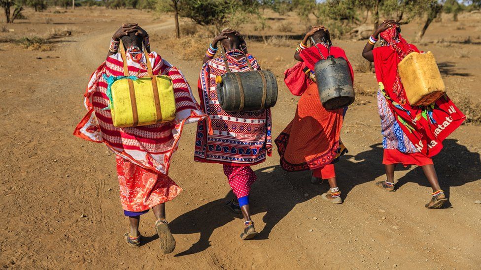 Maasai women carrying water in Kenya
