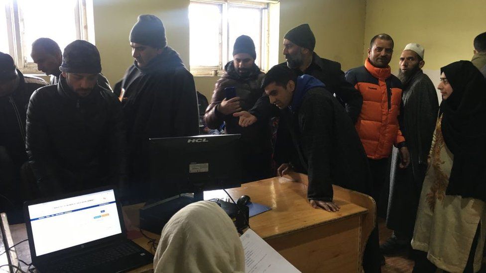 People at the Anantnag information office