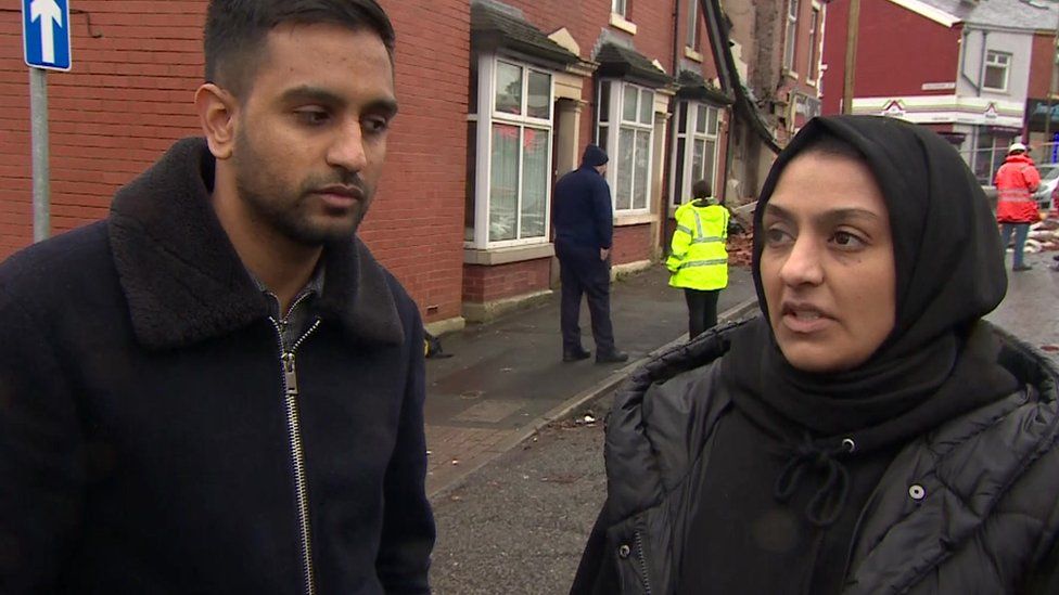 Uwais Patel and his sister Femida near their home after the explosion