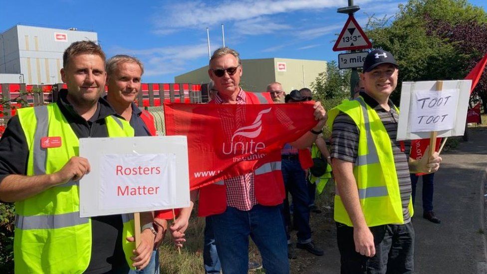 Workers on strike outside Muller's factory in Gloucestershire
