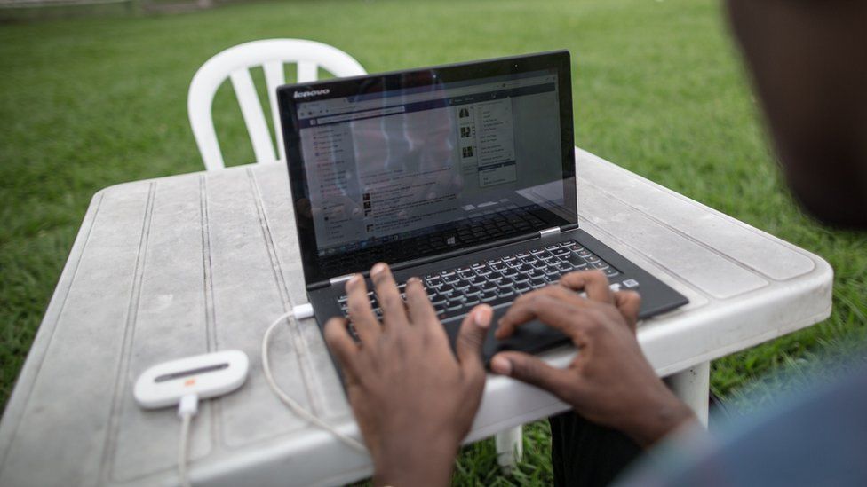 A young African engineer connects his laptop to internet on 25 February 2015.