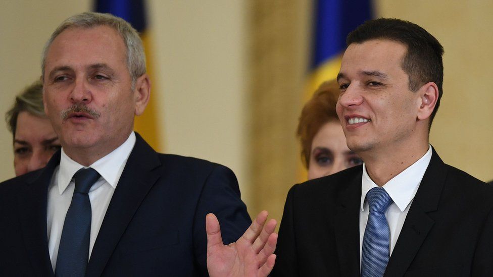 Liviu Dragnea (L), president of Social Democrat Party (PSD) ruling party next to Romanian Prime Minister Sorin Grindeanu after the swearing in ceremony at the Cotroceni Palace, the Romanian Presidency headquarters in Bucharest on January 4, 2017