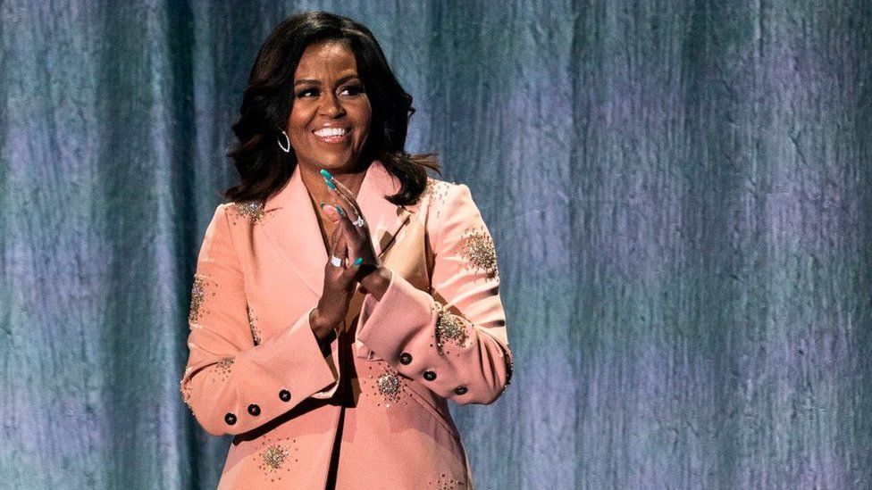 Former US first lady Michelle Obama gestures on stage of the Royal Arena in Copenhagen on April 9, 2019 during a tour to promote her memoir "Becoming"