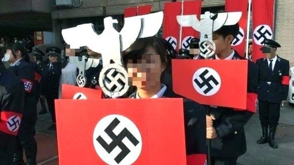 Taiwan 'Nazi rally' school principal resigns - BBC News