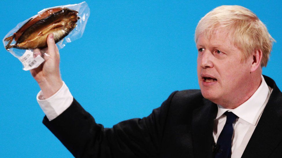 Picture of Boris Johnson holding a kipper at the Conservative leadership hustings