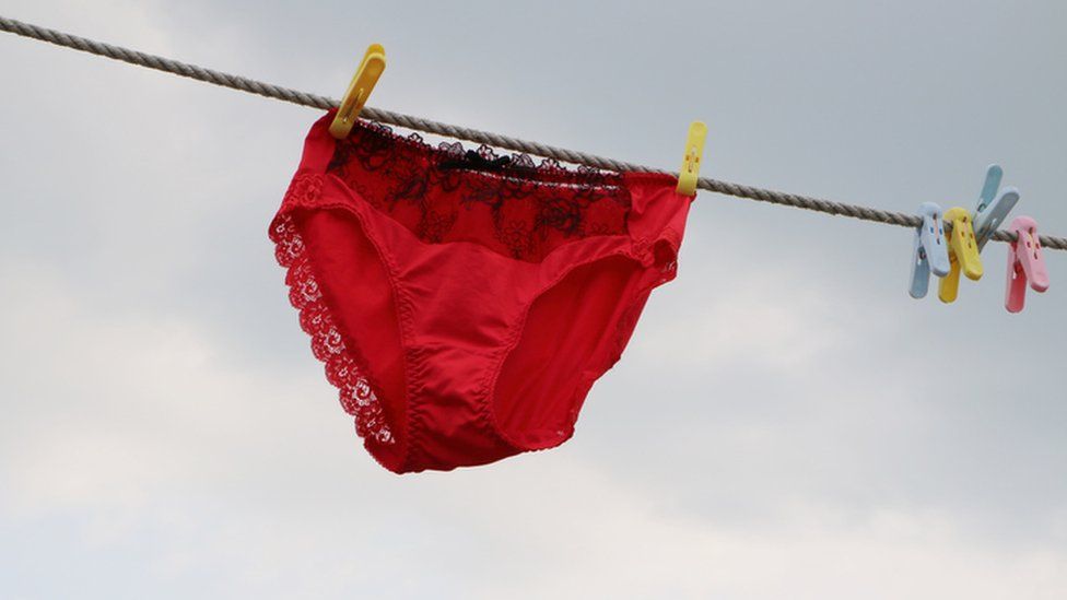 A pair of red knickers on a washing line