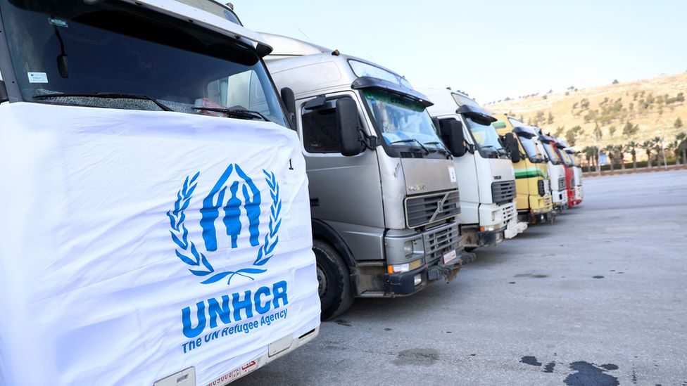 Trucks carrying aid into Syria