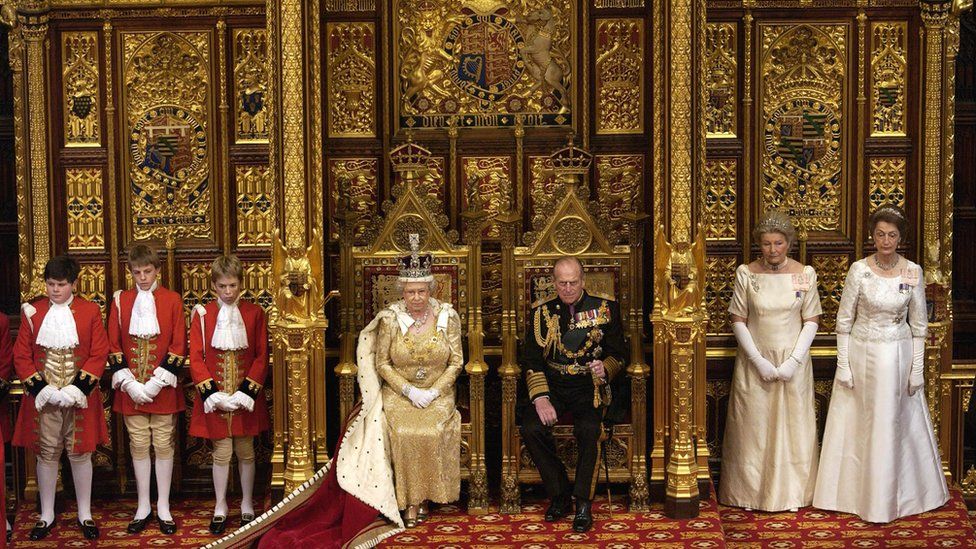 Queen Elizabeth II And Prince Philip Seated On Thrones At The State Opening Of Parliament Held In The House Of Lords. The Queen And Prince Philip Are Accompanied By Ladies-in-waiting And Pages Of Honour. The Ladies-in-waiting Are Diana Lady Farnham And Lady Susan Hussey (far Right). (Photo by Tim Graham Photo Library via Getty Images)