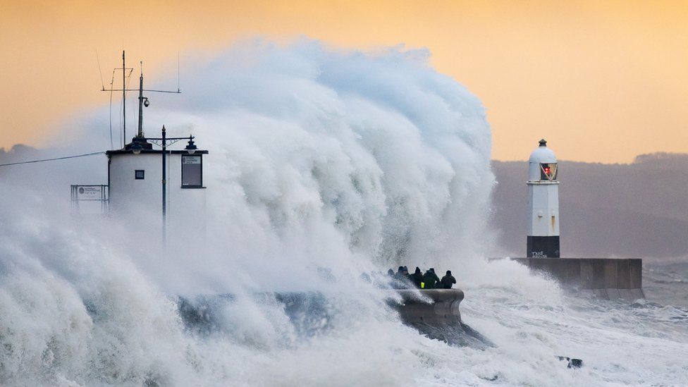 Waves crashing over Porthcawl harbour
