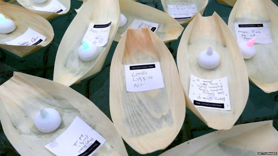 Small boats with colourful electric tea lights in Trafalgar Square