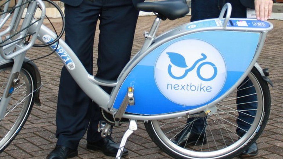 Councillor Caro Wild and Julian Scriven, from Nextbike UK, with one of the bikes