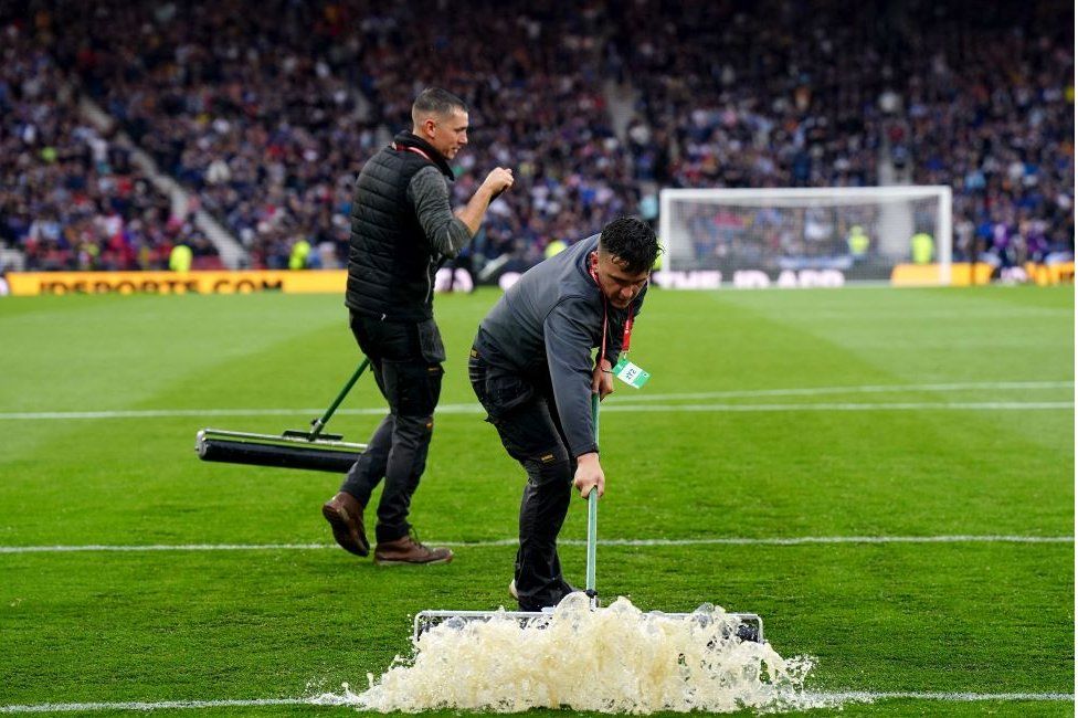 Clearing Hampden pitch of water